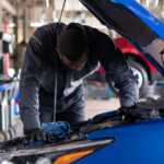 Technician Working on Chevy Engine